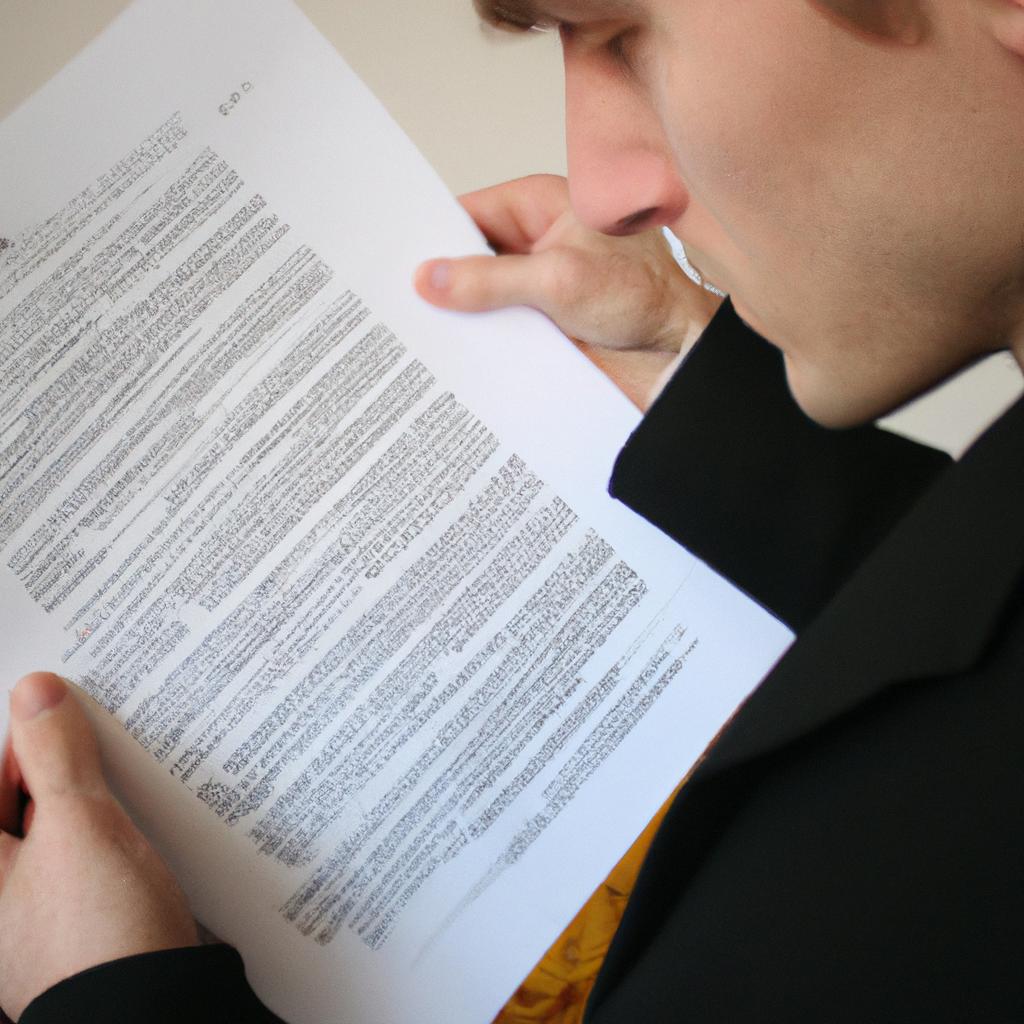 Person reading legal documents attentively